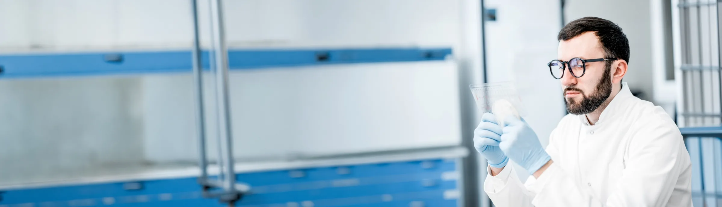 Quality specialist inspecting a sample in an Implai laboratory